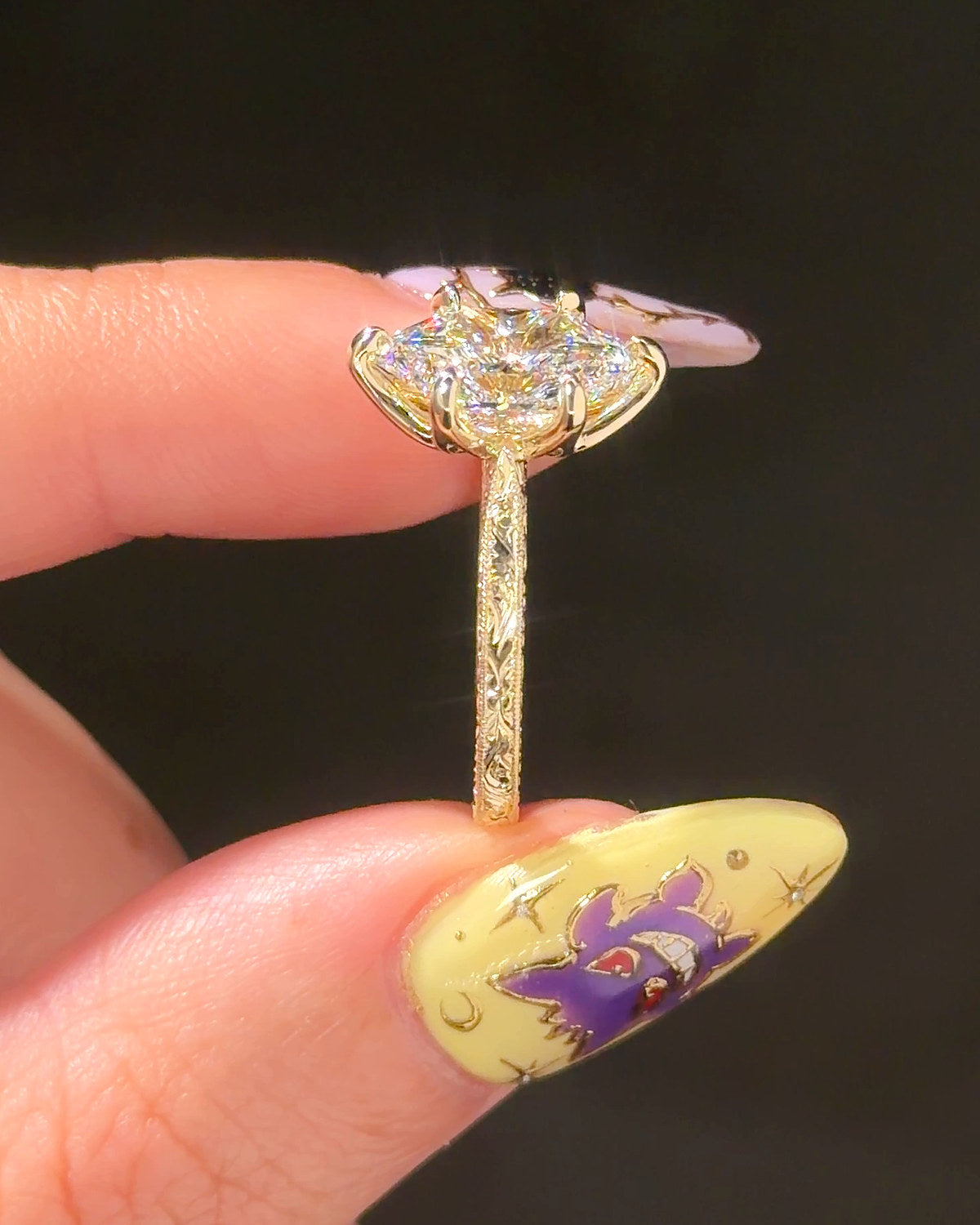 Victoria Dutch Marquise Hand Engraved engagement ring, end view showing the engraved band in 14K yellow gold