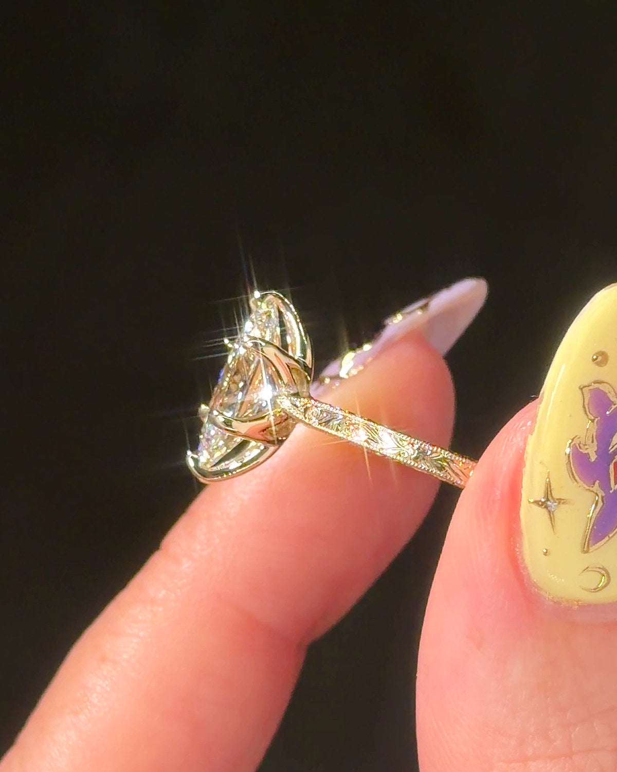 Victoria Dutch Marquise Hand Engraved engagement ring, angled view of the engraved band in 14K yellow gold