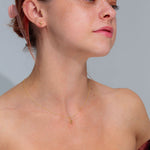 14k Yellow Gold Kira Necklace Dainty adjustable chain with star pendant solid gold high polish chain and pendant at princess bride diamonds in huntington beach california on model 